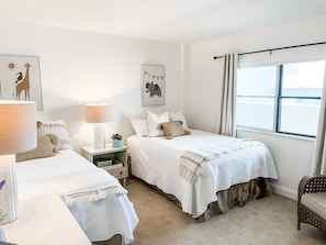 This room can sleep up to three kids. A full size bed and a twin size bed will welcome you after a long day at the beach or pool.