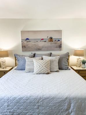 Indulge in comfort and luxury in the master bedroom of this stunning home. Relax on a brand new king bed, surrounded by all new bedding and pillows. Enjoy a sitting area and unwind in the en suite bathroom, complete with a tub and shower.