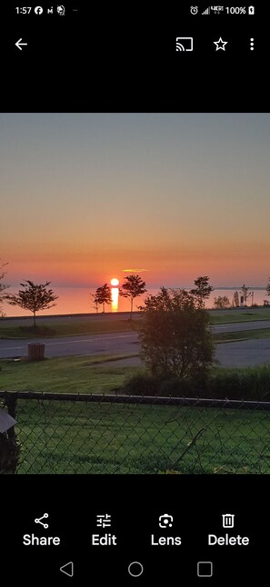 morning sunrise off 10 x 20 deck with gas grill and seating. 