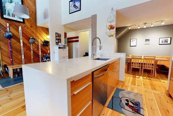 New Kitchen with Caesarstone counters, Moen faucet, and stainless appliances.