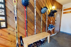 Ski boot heaters, heated tile floor, and hooks for jackets and gear in entry.