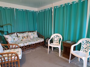 Four Season Sun Porch. Commercial fan. Xtra card table & chairs for in or out.