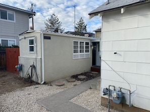 Walkway From the Front of the Property to the Back Where the Unit is Located