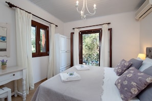 The double bedroom with doors onto the balcony