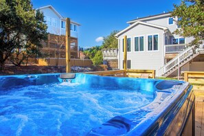Relax in the bubbly Hot Tub after a day at the beach.