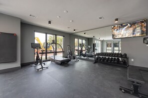 Communal Area: Gym offering a wide range of workout equipment, and a Smart TV.