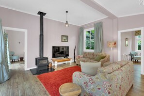 Cosy living area with wood burner 
