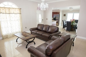 Living room with comfy couches located when you enter the entraance door
