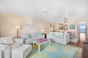 Looking back into the living from from the lanai. - Pull-out sofa bed and 55" SMART TV and ceiling fan.