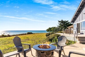 Top shelf relaxing; fire table with an ocean view