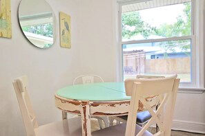  Kitchen has a cozy breakfast nook overlooking the fenced backyard.