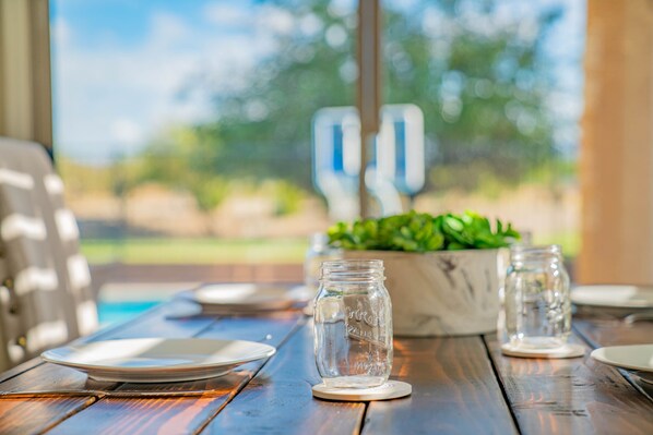 Dining Room: Window looks over the pool to keep a watchful eye on the family and friends