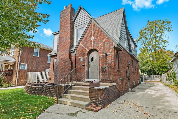 With its cozy front porch and inviting staircase, this brick house is the perfect place to call home away from home.