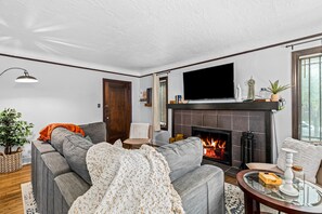 This cozy living room is the perfect place to spend a winter evening. Gather around the fireplace with your loved ones and enjoy a glass of wine or hot chocolate.