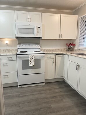 Fully stocked kitchen with dishwasher