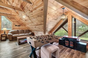 Foosball, arcade and games in the loft area