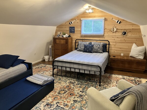 Upstairs, Queen bed & twin trundle bed. Rocking chair and lamp for relaxing.