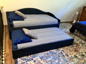 Twin day bed with trundle upstairs. Pull out trundle, if needed.