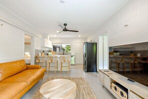 Enjoy a seamless flow from the inviting living area to the well-equipped open-plan kitchen, creating the perfect space for relaxation and culinary delights.