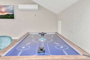 Air Hockey table on the 2nd living room
With a smart TV and a sofa couch
