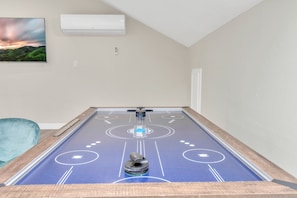 Air Hockey table on the 2nd living room
With a smart TV and a sofa couch
