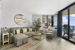 Ocean Front Living Area with Flat Screen TV and Private Balcony Access