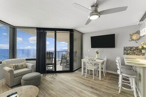Ocean Front Living Area with Flat Screen TV and Private Balcony Access
