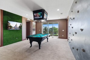 Pool table, rock climbing wall, and Jumbotron w/ 4x TVs + poker table