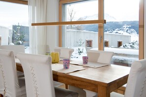 Living/dining area with access to the fenced garden
