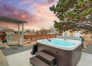 Indulge in relaxation with our hot tub. Unwind and enjoy the soothing warmth, creating a perfect oasis for your stay.,