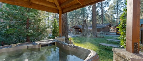 Private hot tub under a gazebo.