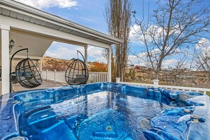 Relish the expansive wrap-around deck featuring an outdoor Jacuzzi that provides uninterrupted 180-degree views day and night, offering peace and tranquility.