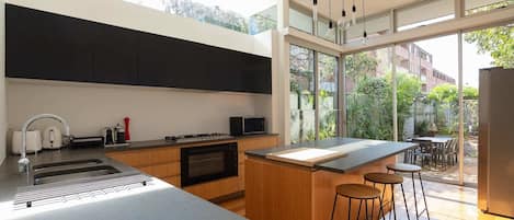 Amazing entertainers kitchen and flow to garden area