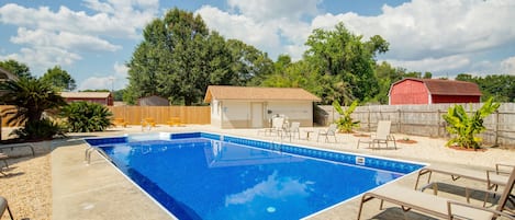 Pool with lounge chairs and gameroom