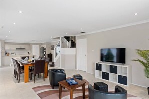 A sitting area provides a cosy post-dinner spot to relax with some TV. 
