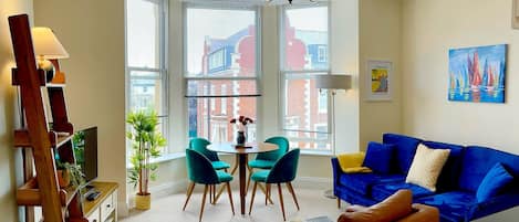 Spacious livingroom with bay window views