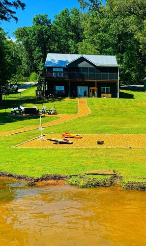 Enjoy the tranquility of gazing upon the lake from nearly every room in the house. And, watch all the fun backyard activities!