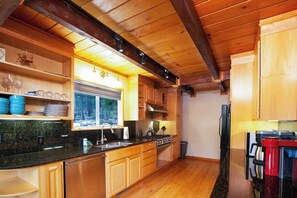 MAIN HOUSE - Fully equipped kitchen with gas range, double stoves, full sized refrigerator, dishwasher, microwave, drip coffee, Nespresso, tea kettle, knives and toaster. 
