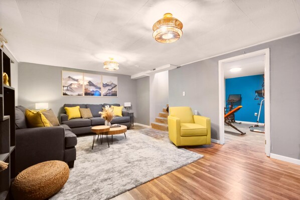 Spacious living room with unique chandelier