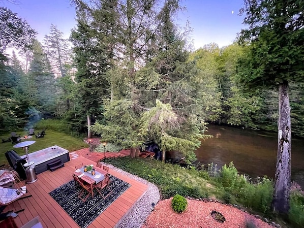 The proximity of the patio to the river is amazing! Bonfire! Hot tub! Patio with dining table! River by the tranquil Boardman River! What else could you ask for??
