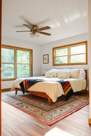Main floor master bedroom with king bed facing southern light and the river!