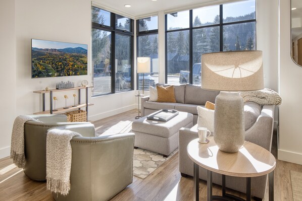 Our spacious living room boasts a Smart TV and features a comfortable pull-out sofa for your convenience.