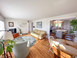 Cozy living room over looking Skaneateles lake and a historic barn. 