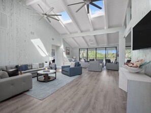 View towards pool and patio from expansive living room