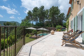 large terrace with sunbeds and a beautiful view