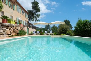 Large pool with sunbeds to relax
