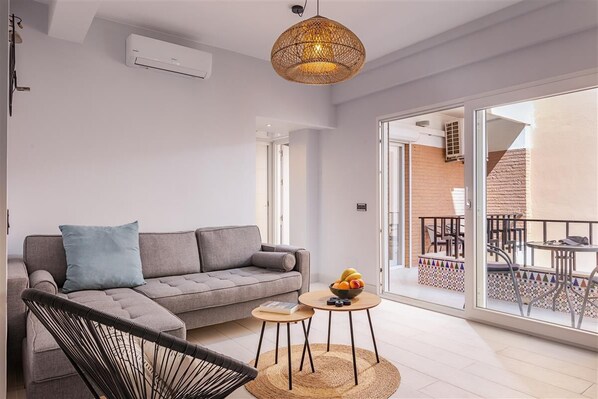 Modern and bright lounge area with air conditioning in this apartment