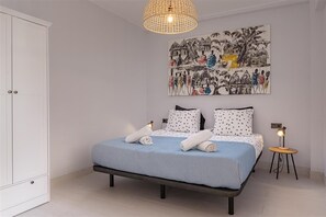 Master bedroom with a super king size bed and spacious wardrobes