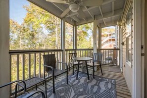 Step out onto the private, screened-in outdoor patio to enjoy a breath of fresh air, a morning cup of coffee, and listen to the birds sing.