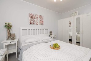The bedroom's elegant decor creates a serene and restful environment.
